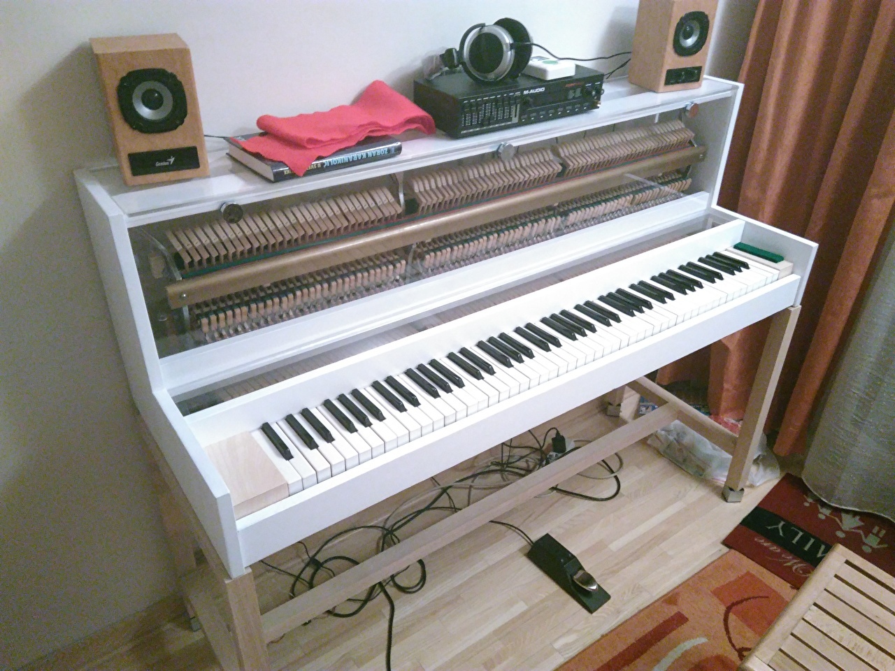 Hybrid piano. No strings just wooden mechanics.